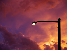 Lamp Post In Silhouette Against Sunset