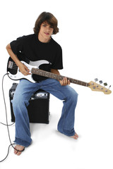 boy with black and white bass guitar sitting on am