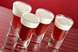 Glasses of red gelatin and cream