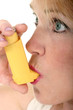 woman using asthma inhaler 2
