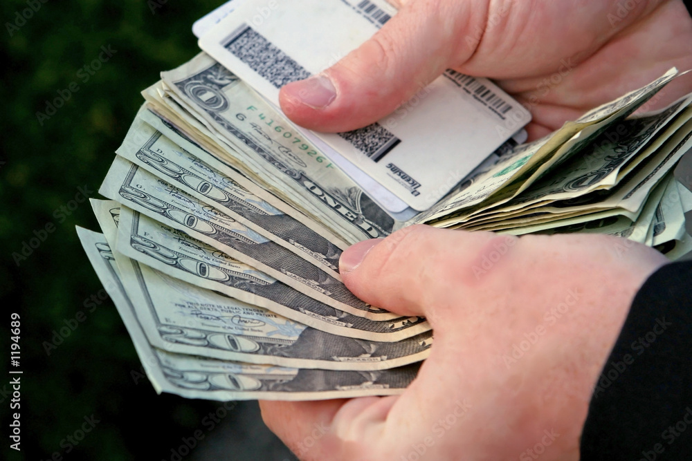 cash transaction. Stock Photo | Adobe Stock