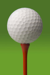 Wall Mural - golf ball on red tee, green background