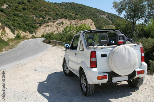 Fototapeta na wymiar little white jeep on an island