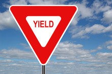 Yield Sign With Clouds