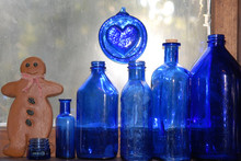 Blue Bottles With Gingerbread Man