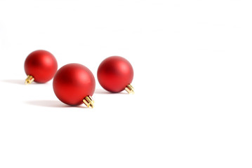 three round red christmas ornaments