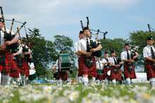 Scottish Band Marching On Grass