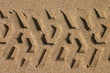 tyre track of a lifeguard beach buggy in sand
