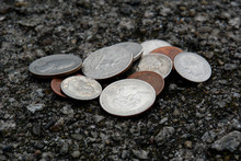 Stack Of American Coins On The Ground