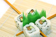 roll sushi structured over white
