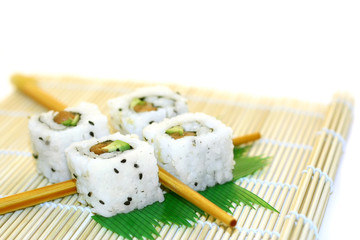 roll sushi structured over white