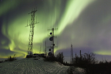Wall Mural - scientific antennas under night sky with northern