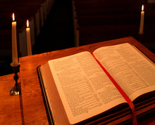 Bible On Pulpit In Candlelight - Angled View