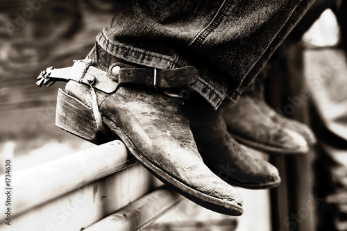Fotografía row of rodeo boots & spurs
