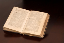 An Open Old German Bible Resting On A Table
