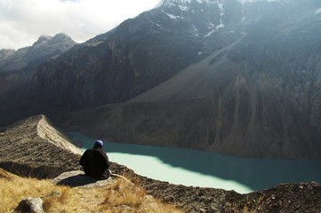 Canvas Print - hiker relaxing on mountain lake