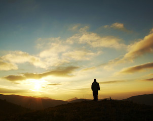 Wall Mural - girl silhouette on sunrise