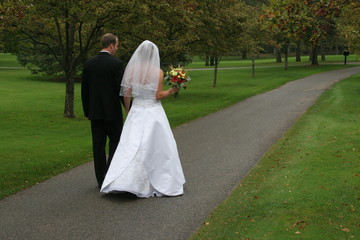 Sticker - bride and groom walking down path in white dress