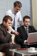 © endostock - young business men working with latop in office