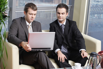 young business men working with latop in office