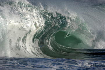 giant wave crashing on shore