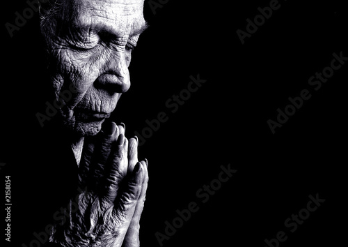 Fototapeta na wymiar old woman praying