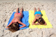 © Nick Stubbs - two sexy young girls laying on a sunny beach on va