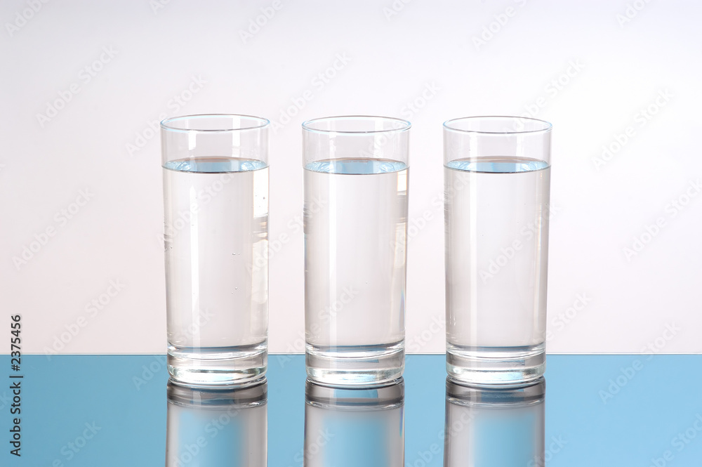 three glasses of water with reflection Stock Photo | Adobe Stock