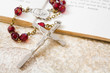 rosary beads on a book of psalms