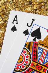 blackjack/pontoon cards with a gold glitter backgr