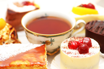 Wall Mural - sweet cake with berries and a cup of tea