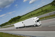large truck speeding on straight highway