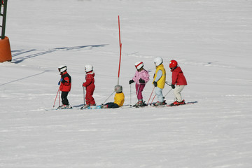 kids on a ski piste