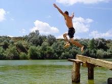 Boy Jumping In Water