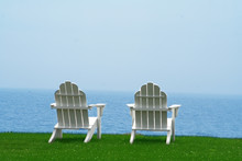 Two Chairs Looking Over An Amazing Ocean View On A