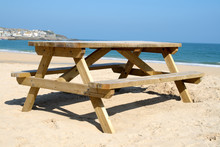 A Wooden Picnic Table On The Beach In St. Ives, Co