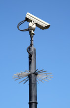 Street Security Cctv Camera And A Blue Sky.