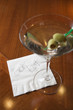 Martini with napkin reading 