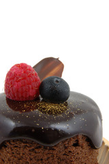 Wall Mural - chocolate cake with raspberry and blueberry topping