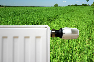 radiator on a green field