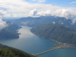 aerial view of a lake between the small alps mountains, come lak