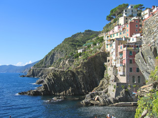 Wall Mural - riomaggiore village on the top of a stone cliff, the cinque terr