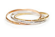 three gold bracelets isolated on the white
