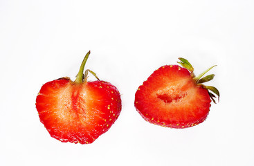 two halves of a strawberry