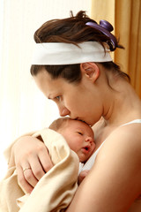 happy mother with newborn baby