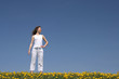 © Studio Light & Shade - Calm young woman standing in a flowering spring field.