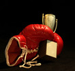 canvas print picture - red boxing glove holding a shining cup, closeup