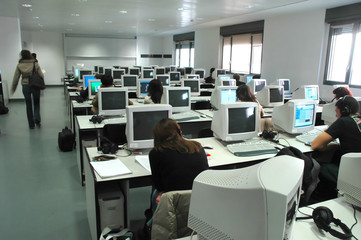 Team of young people working in corporate call center