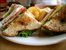 Turkey BLT Sandwich With Potato Chips At Diner