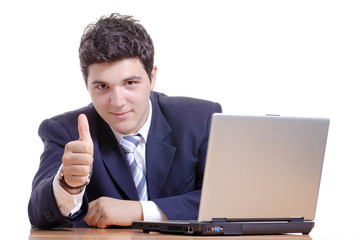 Businessman working on a computer with his thumb up